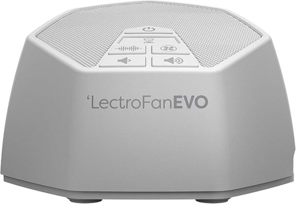 White LectroFan Evo device on a bedside table, with simple control buttons visible on its top surface.