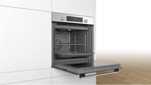 Open Bosch built-in electric oven showing spacious interior with racks