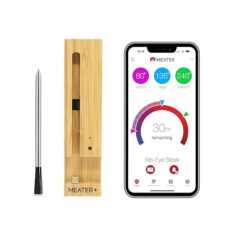 MEATER Plus thermometer probe, wooden charging dock, and smartphone displaying the MEATER app interface